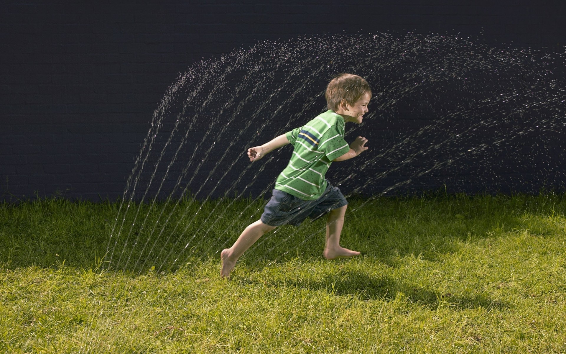 boys grass balloon water running