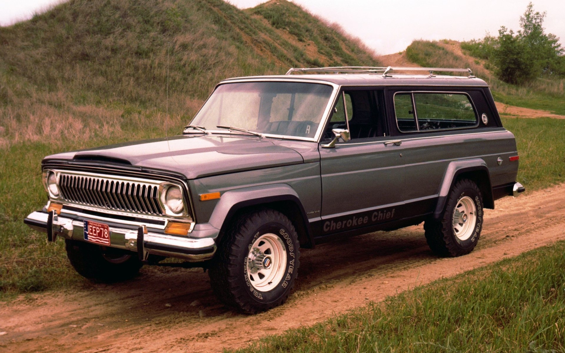 jeep cherokee główny 1976 cherokee suv przód droga wzgórza tło