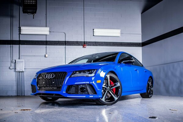 Sporty bright blue audi rs7 car