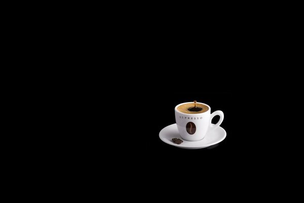 A cup of coffee on a black background