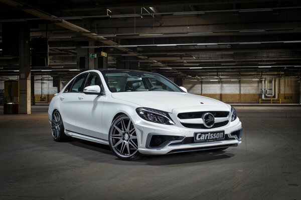 A Mercedes c-class car is parked in the parking lot