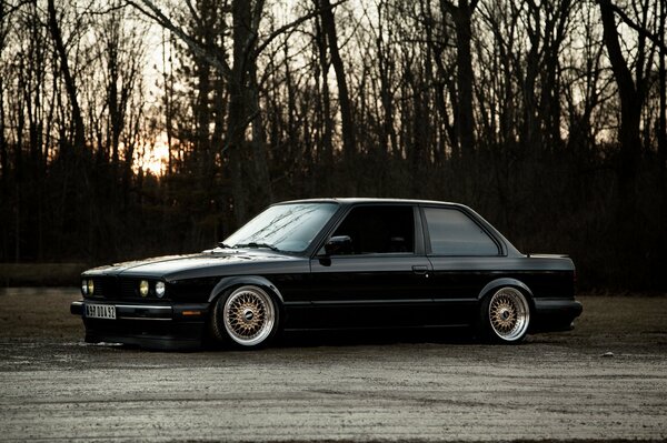 Black BMW with lowered suspension