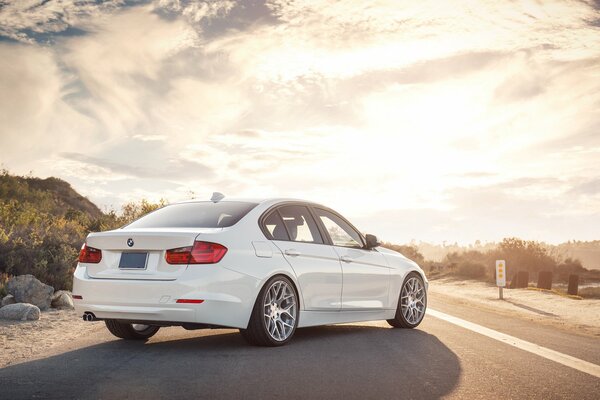 BMW sedan 3 series in the rays of the sun