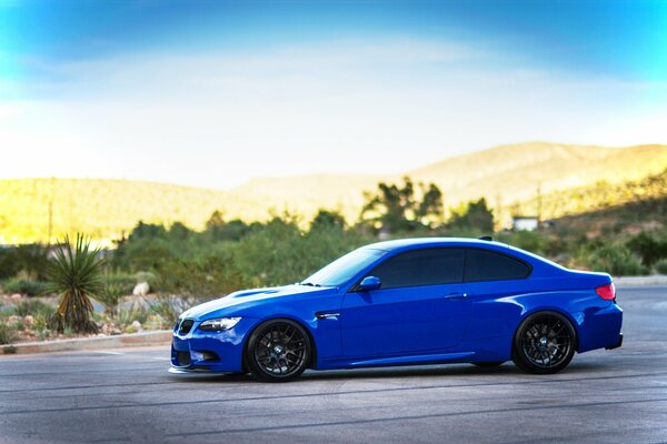 Blue sports car in the parking lot