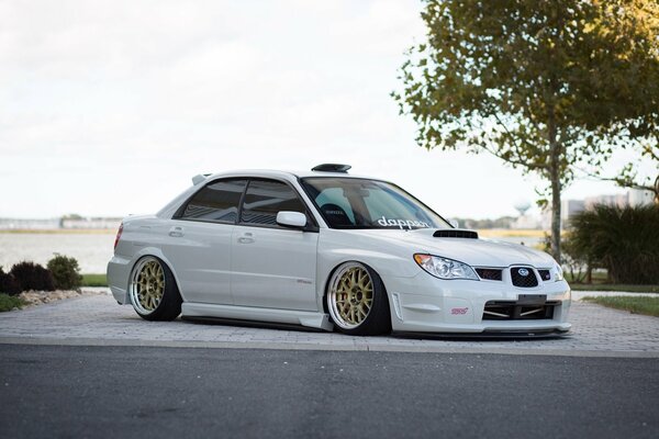 White tuned Subaru Impreza