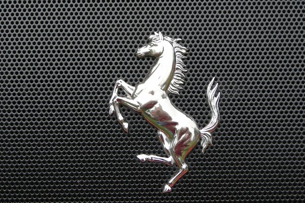 Lattice with a metal emblem in the shape of a horse