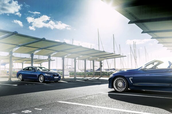 Blue tuned BMW convertible and sedan