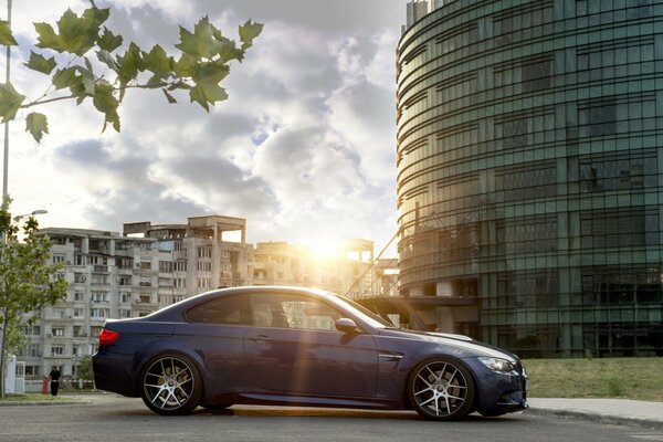 Blue car on the background of the city