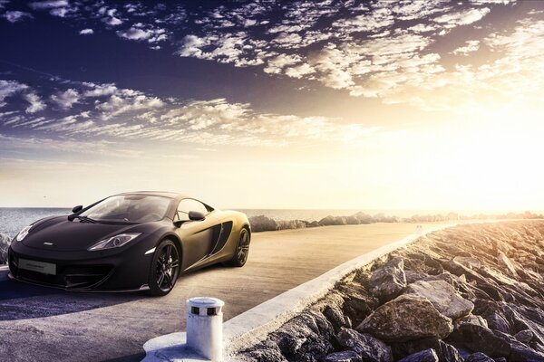 McLaren on the highway under the clouds