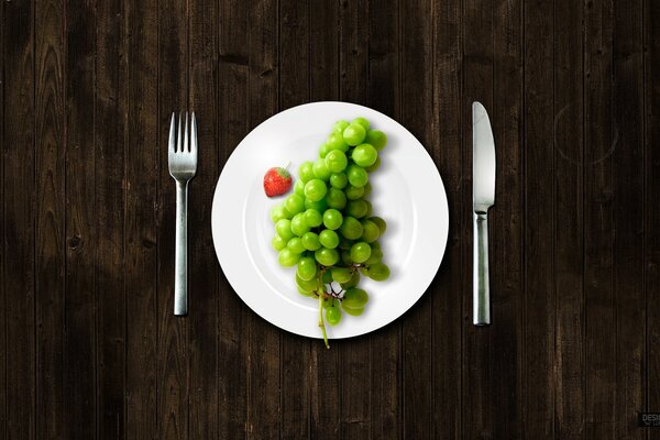 Table served with a plate of grapes