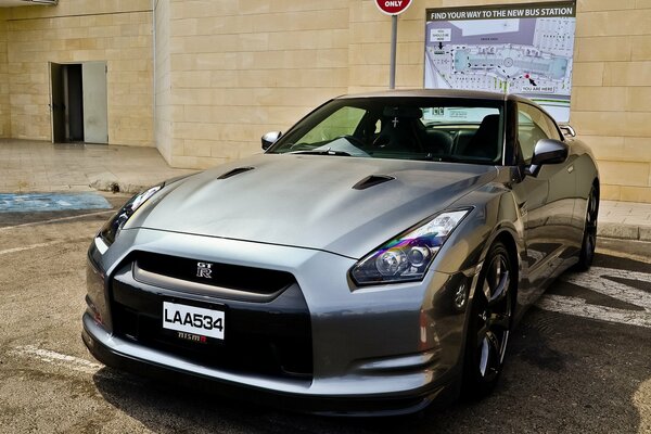 Nissan gt-r r35 in the parking lot of the European fashion House