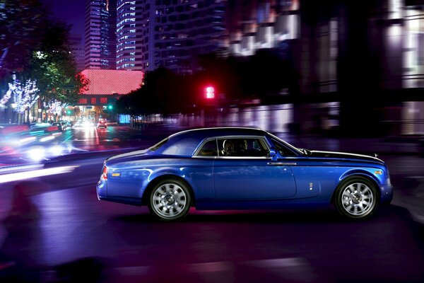 Ghostly Rolls-royce phantom luxury coupe in the night city