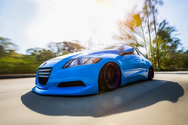 Blue car in traffic on the highway