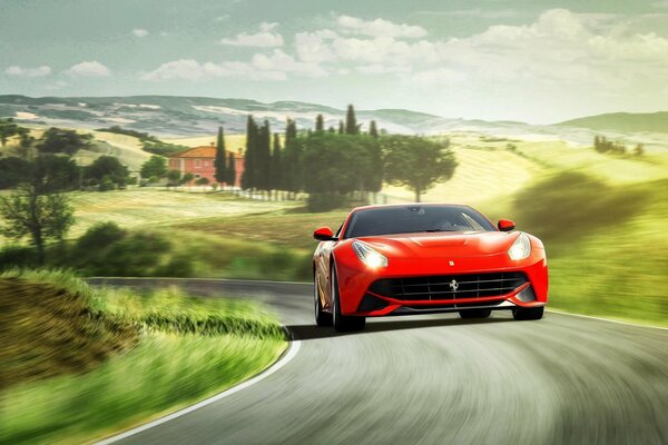 Jasne czerwone Ferrari Berlinetta jedzie po drodze