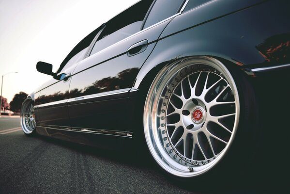 BMW car wheels on asphalt