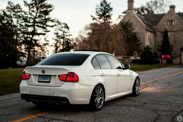 White BMW Sedan 3 Series on the road