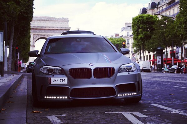 Grey BMW in the parking lot in the city