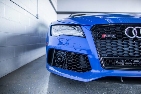 The front headlight of an Audi car