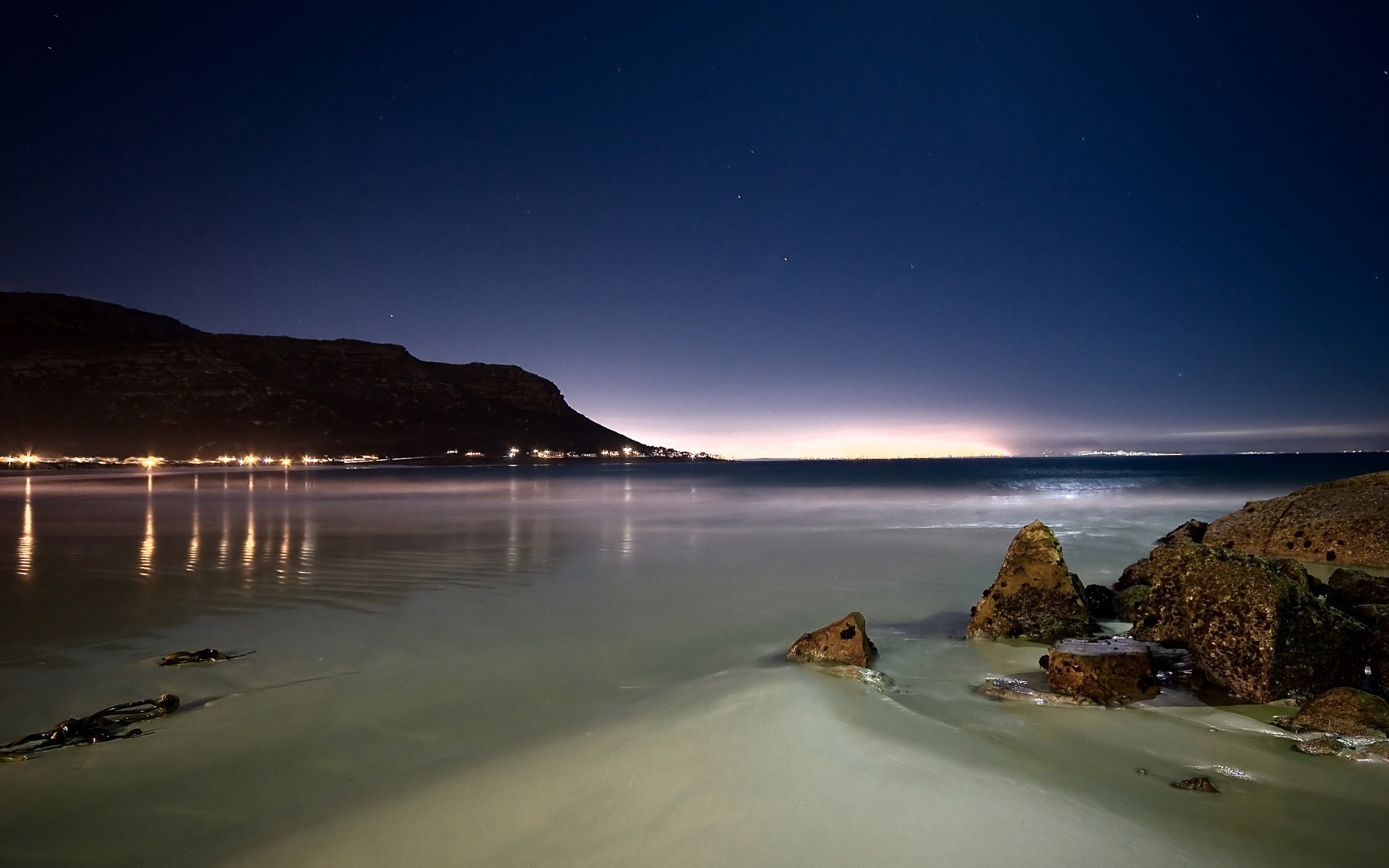 orilla noche piedras luces