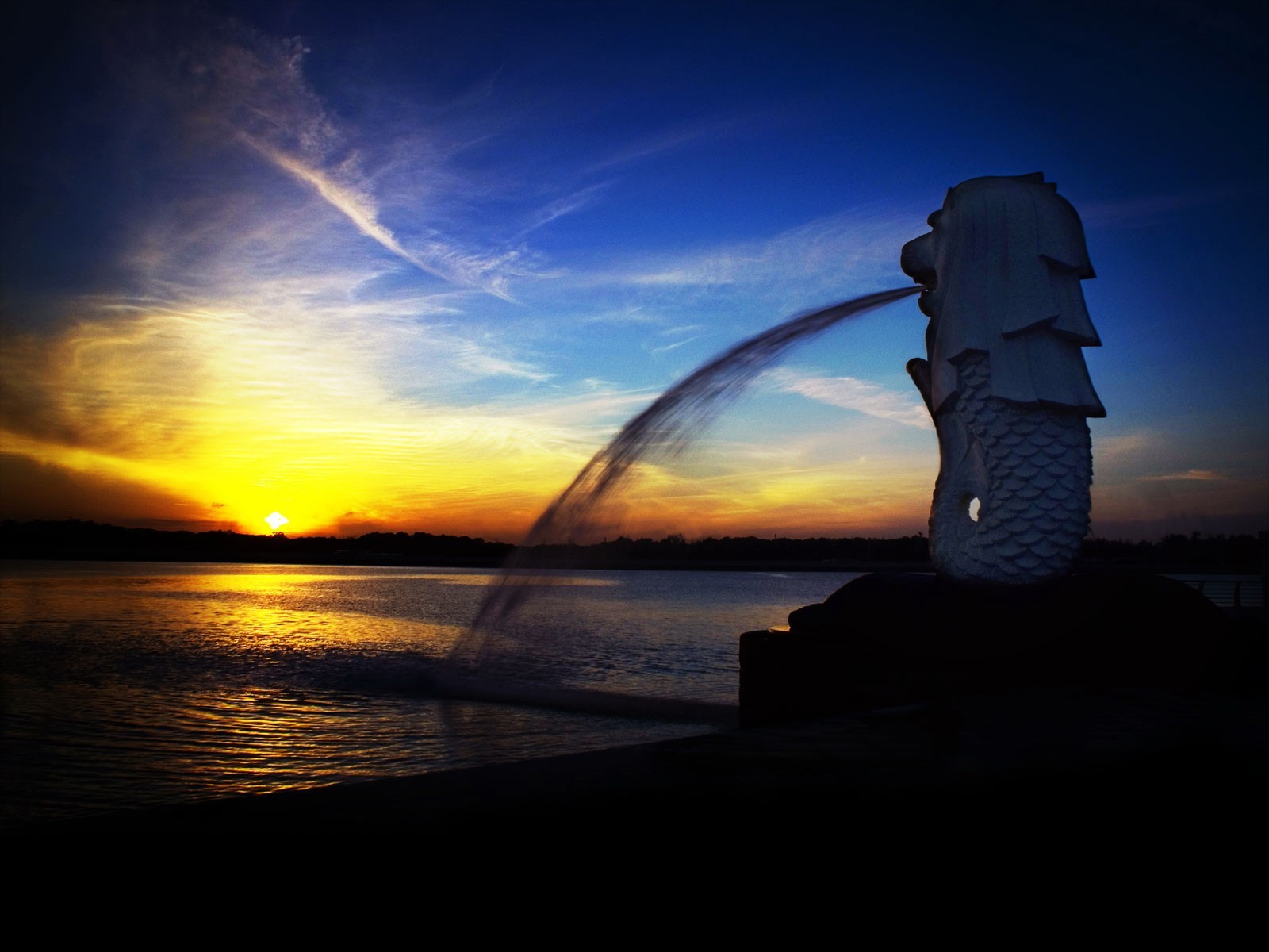 tramonto fontana singapore statua merlion