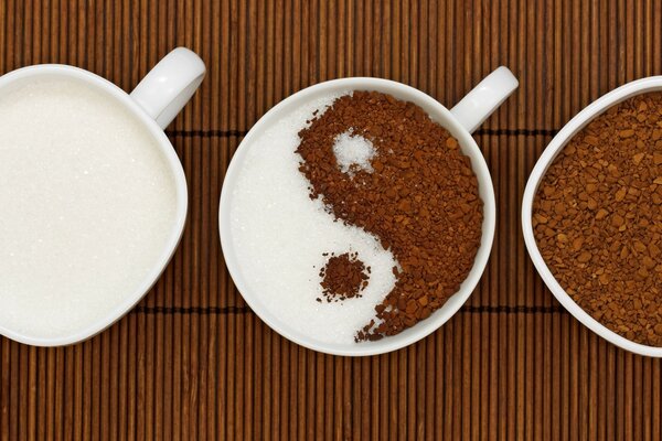 Coffee in the form of yin yang and with sugar