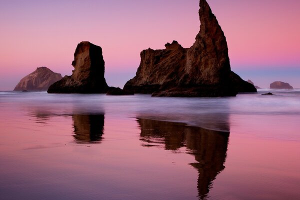 Reflection of rocks on the shore