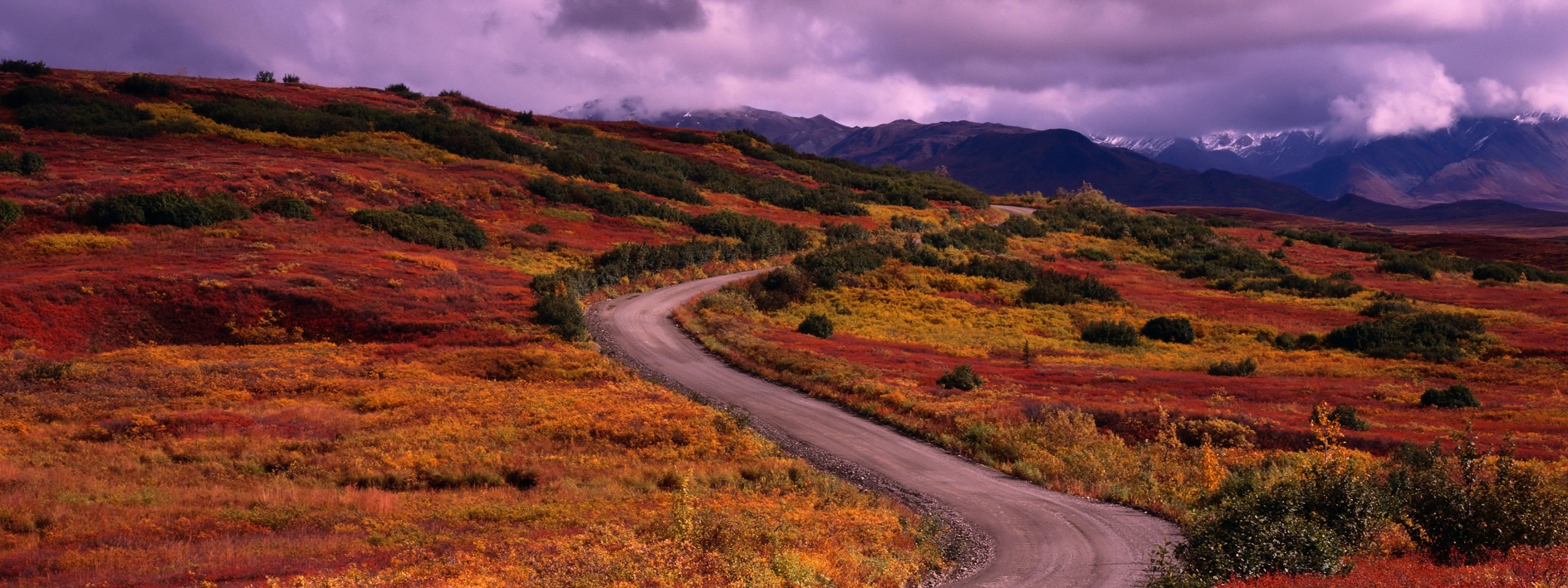 road grass clouds mountain