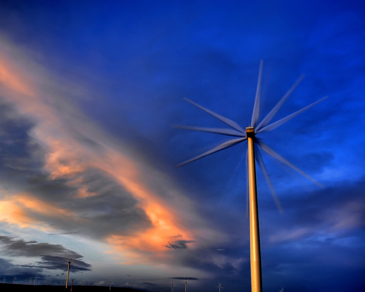 a windmill sky clouds blue