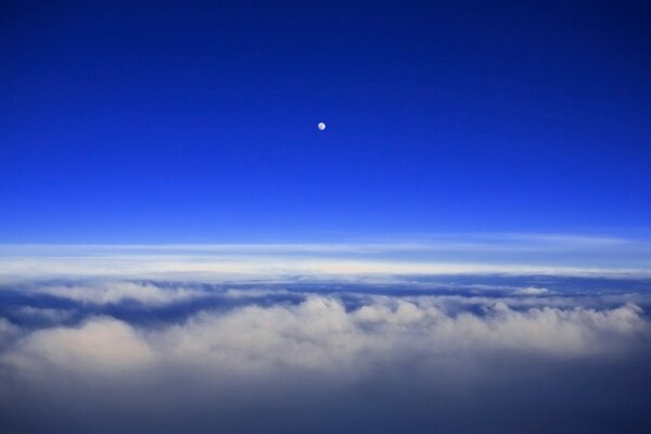 A new moon in the blue sky