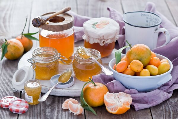 Photos of a picnic, jars of honey, fruit in a plate