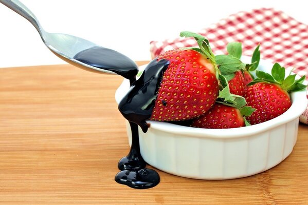 Strawberries in a cup , poured with chocolate