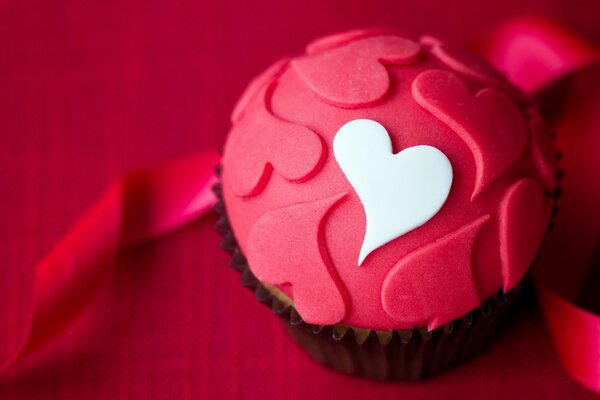 Romantic dessert cupcake in icing with hearts