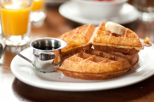 Belgian waffles with orange juice for breakfast