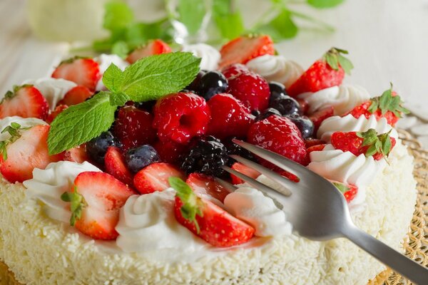 Delicate cake with berries and mint