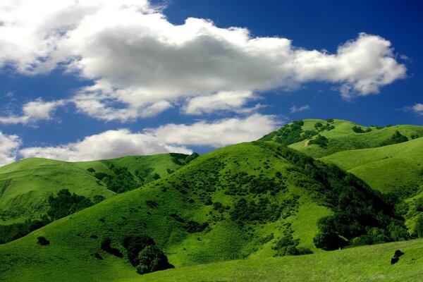 Green hills and clouds in the sky