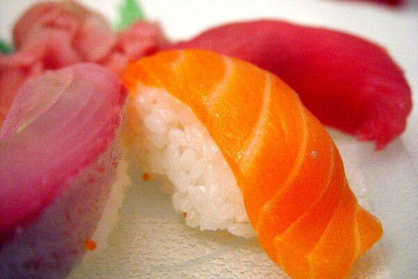 Close-up of sushi laid out on a white platter