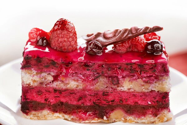 Delicious raspberry cake with icing and nuts