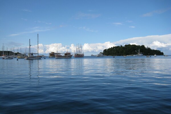 Beautiful photo of the sea on which the island is located and yachts sail