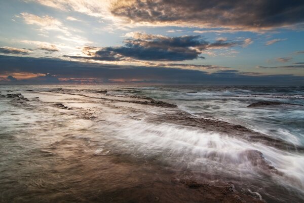 White waves and fluffy clouds