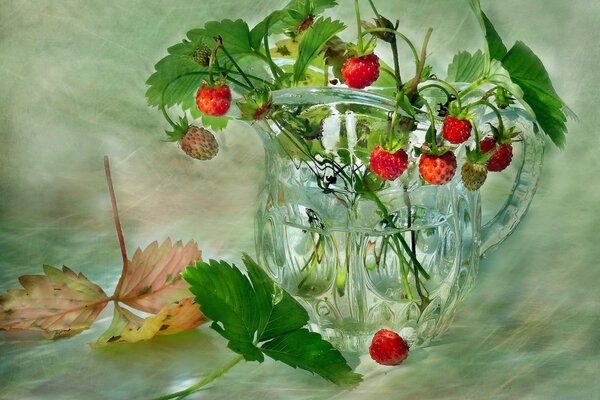 Picture. Strawberries with leaves in a vase