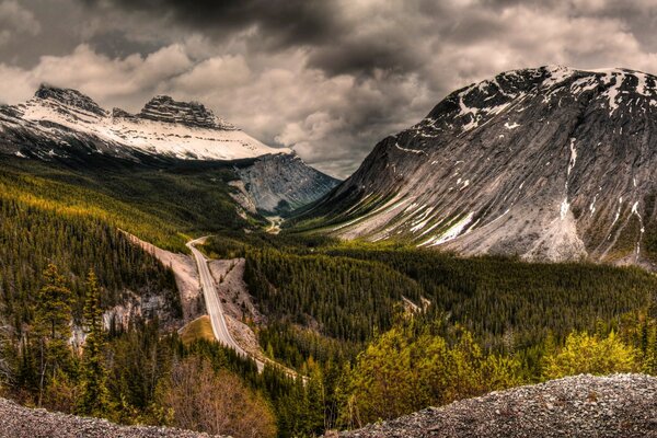 Beautiful landscape, mountains and trees, thick clouds