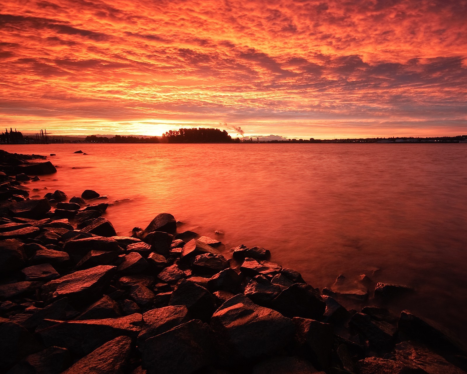 tones sunset red clouds water