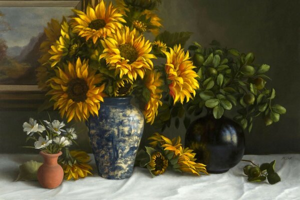 Still life with sunflowers and daisies on the table