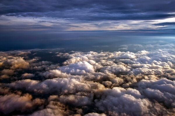 Flying above the clouds in the sky is full of light