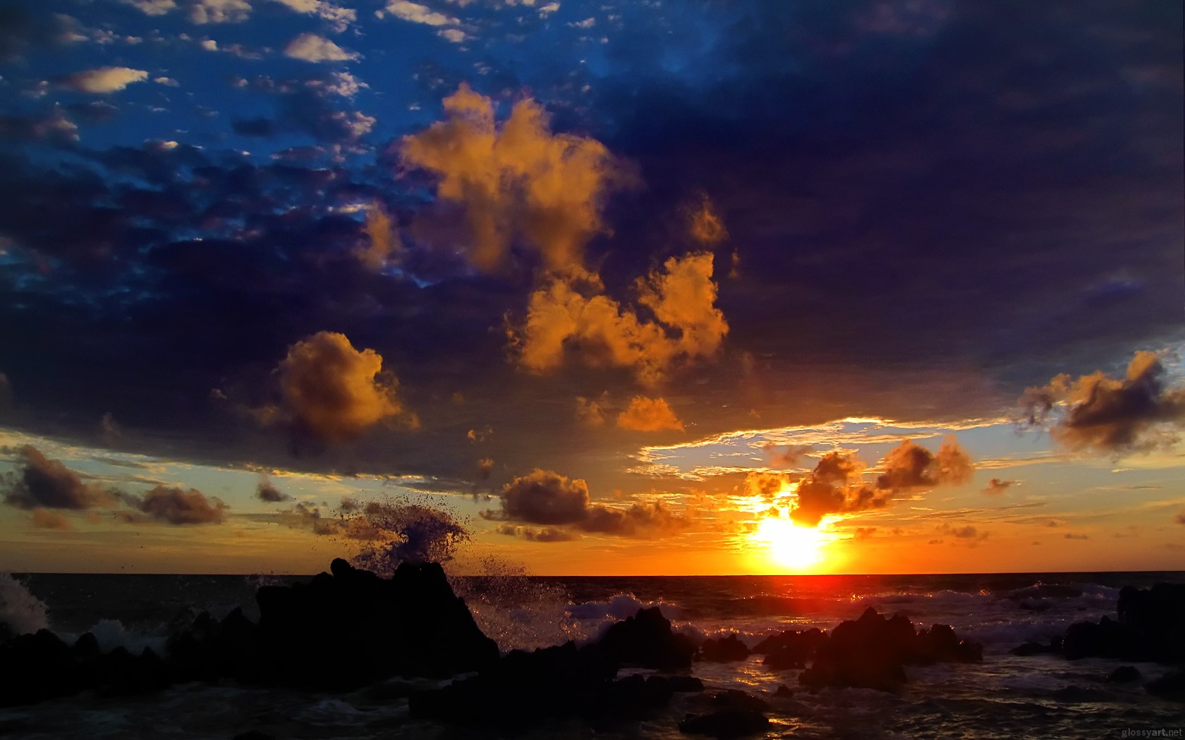 mer vagues pierres ciel coucher de soleil