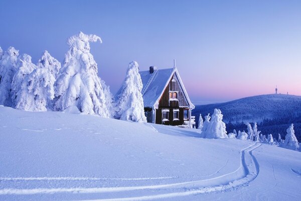 A house in the snow in winter