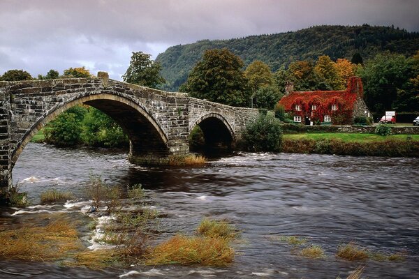 Bridge over the river, a house in the distance