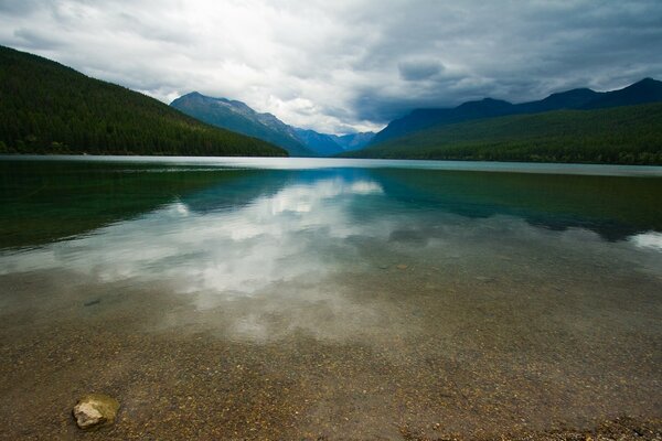 In the mountains, a lake with glazed water