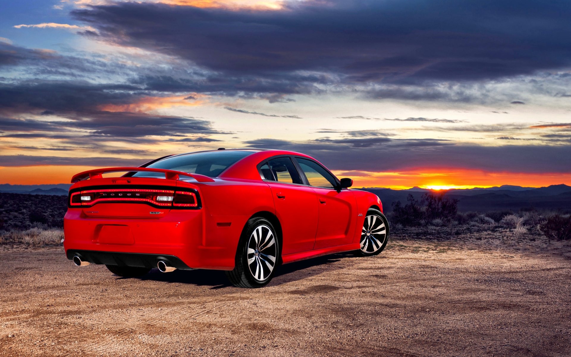 esquivar cargador auto rojo dodge cielo puesta del sol tarde sedán