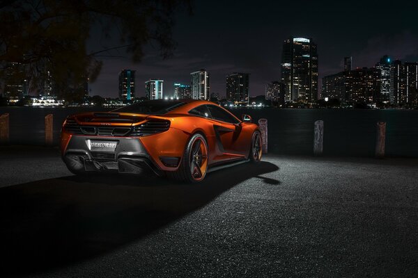 McLaren mp4 -vx supercar. Orange McLaren at night